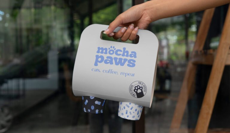 logo design and packaging mockup for a cat cafe brand mocha paws on a cup holder design