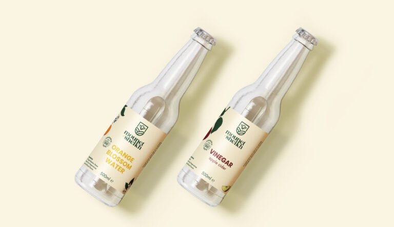 logo and packaging design for mouneh preservation brand on a glass bottle mockup
